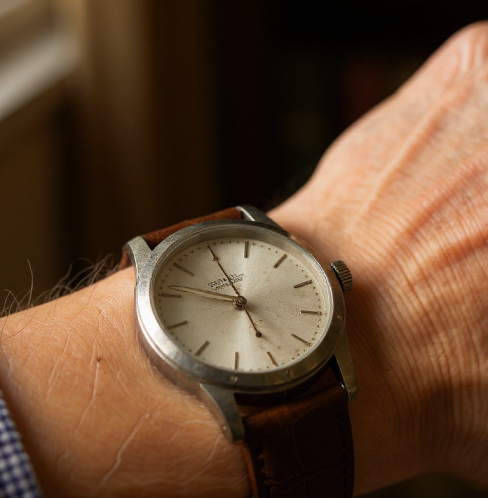This worn silver watch... it used to mean something. Now it just feels like a reminder of all the time I've wasted. Can't even keep good time anymore.